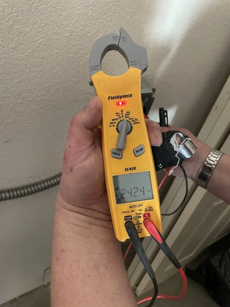 Voltage testing with clamp meter during Electrical Installation Services in San Antonio Heights